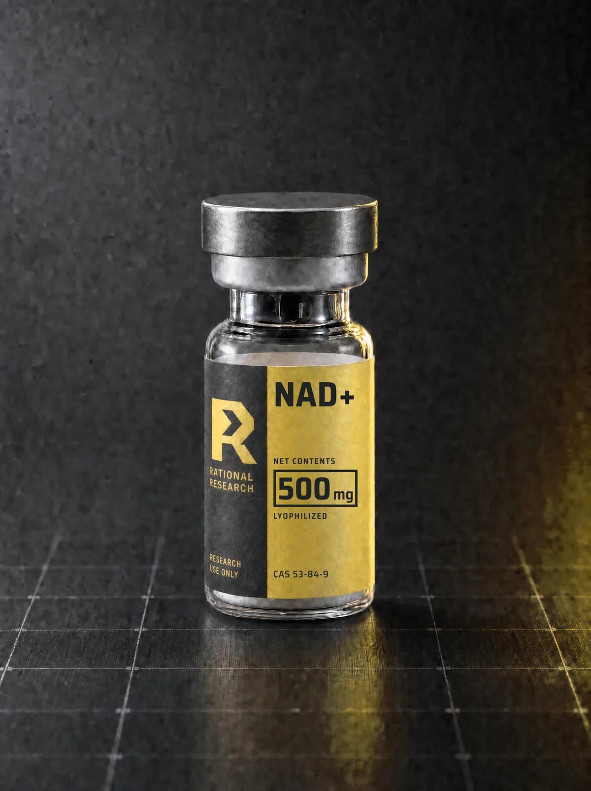 A sealed research vial carrying the printed Rational Research label for NAD+, standing on a graphite panel
